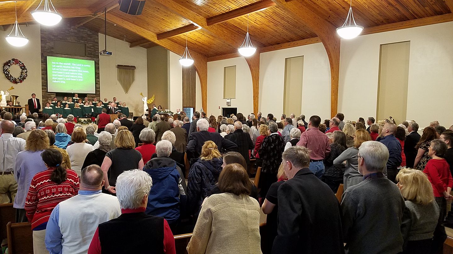 congregation standing and singing with choir